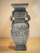 A Chinese bronze twin-handled vase in the archaic style,