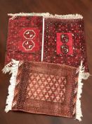 Three Turkoman rugs, each approximately 70 cm x 50 cm.