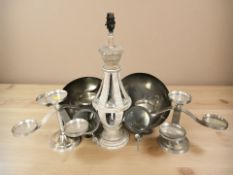 A mid century set of two pillar candle holders each holding five candles and a decorative wooden