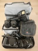 A Canon EOS10 camera, and a further Canon Powershot G5 camera, two Canon lenses, a flash,