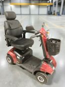 An MM8 electric 8 mph mobility scooter with lead, instruction manual and two keys.
