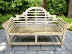 A weathered teak Lutyens style garden bench, 165 cm x 60 cm x 105 cm.