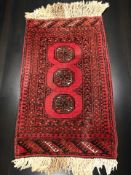 A Turkoman rug, Afghanistan, 110 cm x 58 cm.