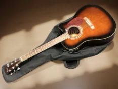 A Tenson electro acoustic guitar with soft carry bag.