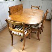 A yew wood twin pedestal extending dining table, with leaf, unextended 161 cm x 97 cm x 75 cm,