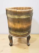 A coopered oak tripod planter, height 49 cm.