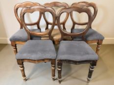A set of five Victorian mahogany dining chairs.