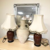A contemporary silvered mirror, a pair of oriental style table lamps, and a twin handled urn,