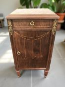 A rosewood and satinwood strung bedside cabinet with gilt metal mounts and rouge marble inset top,
