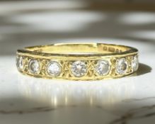 An 18ct yellow gold seven stone diamond ring, size N/O CONDITION REPORT: 3.4g.