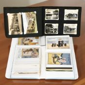 Two albums of antiquarian and later postcards.