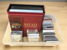 A group of vinyl box sets and CDs