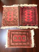 A Turkoman rug, Afghanistan, 87 cm x 58 cm, together with two further similar eastern rugs.