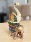 A painted wooden elephant plant stand, height 40 cm, and a similar figure of a swan.