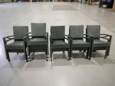 A set of eleven woven plastic garden patio chairs.