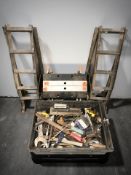 A pair of car ramps and a box of assorted hand tools, files, spanners, clamps, etc.