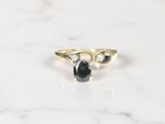 A 14ct yellow gold synthetic sapphire and two stone diamond ring, size M/N.