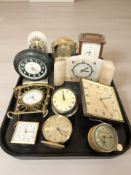 A collection of travel and mantel timepieces including Ingersoll, Schatz, etc.