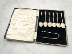 A set of six silver apostle spoons and a pair of sugar tongs, William Devenport,