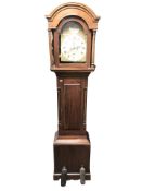 A 20th century mahogany long case clock case containing an associated movement with brass and