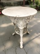 A painted cast iron pub-style patio table, height 74 cm, together with a pair of similar chairs.