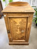 A Victorian figured walnut pot cupboard,