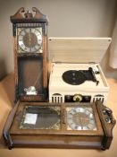 A retro style music player and two reproduction wall clocks.