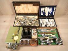 A group of cutlery canteens, stainless steel wares, etc.