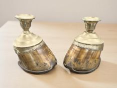 A pair of EPNS-mounted horse hoof candlesticks, height 15 cm.