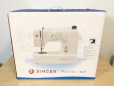 A Singer Promise 1409 electric sewing machine in box