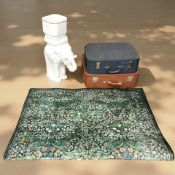 A modern ceramic planter on stand in the form of an elephant,