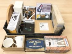 A group of home wares, mugs, golf balls, Overwatch figurine, parking sensor, light box, etc.