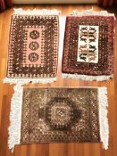 A Turkoman rug, Afghanistan, 84 cm x 54 cm, together with two further similar eastern rugs.
