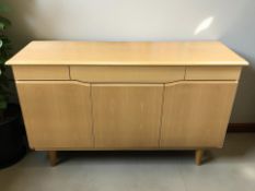 A contemporary pine effect sideboard,