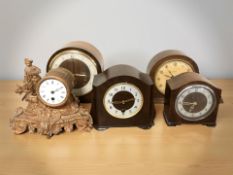 A group of antique mantel clocks including a Smiths Enfield bakelite cased example.