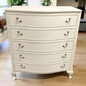A cream and gilt serpentine front five drawer chest, 92 cm x 49 cm x 107 cm.