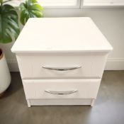 A white laminated two drawer bedside stand, 53 cm.