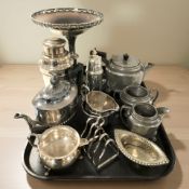 A hammered pewter three piece tea service, further EPNS tea wares, a cocktail shaker,
