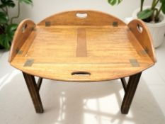 A mahogany butler's tray table, width 77 cm.