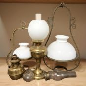 A group of antique oil lamps.