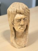A large carved wooden bust of a lady,