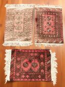 A Turkoman rug, Afghanistan, 77 cm x 51 cm, together with two further similar rugs.