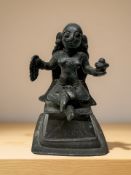 A 19th century Indian bronze devotional temple statue, height 13 cm.
