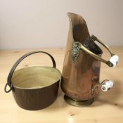 A Victorian copper coal scuttle and a brass jam pan