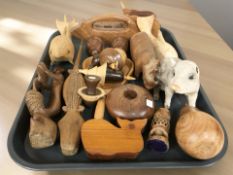 A group of treen animals and other wooden carvings.