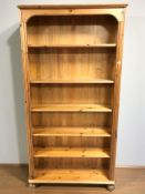 A modern pine open bookcase, 93 cm x 28 cm x 183 cm.