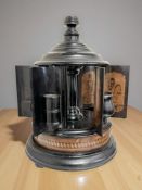 A late 19th century ebonised carousel cigar humidor,