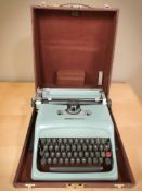 An Olivetti Studio 44 typewriter in carry case.