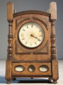 An Edwardian walnut cased combination mantel timepiece / calendar, height 29 cm.