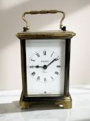 A brass-cased carriage timepiece, signed Bayard, 8 Day, height 14cm including handle.